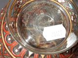 a glass bowl with a label on it