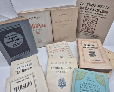 several books are stacked on top of each other on a table