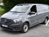 mercedes v - class van parked in a parking lot with trees in the background