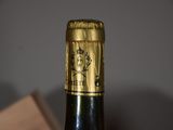 a close up of a bottle of wine on a table