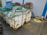 a large container with a net on top of it in front of a building