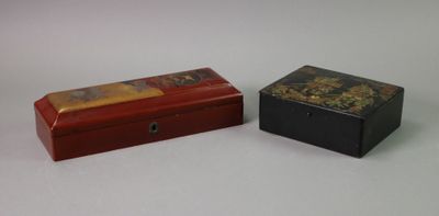 two small boxes sitting next to each other on a table