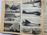 a book with pictures of airplanes in it on a table