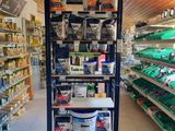 many shelves in the store that have various items on them