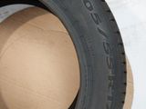 the tire of a car is sitting on top of a cardboard box