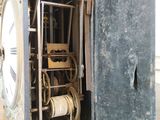 a clock that is inside of a metal box