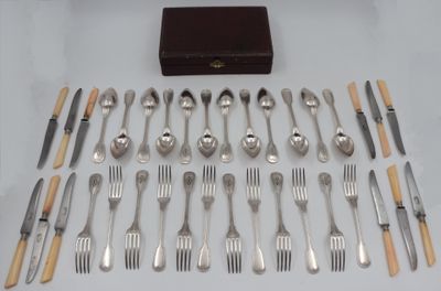 a lot of silverware on a table with a wooden box