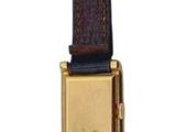 a brown belt with a gold buckle on a white background