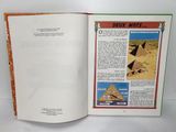an open book with a picture of a pyramid in the middle of it
