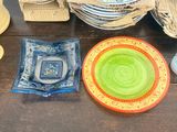 many plates and bowls sitting on a table