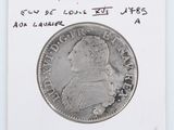 a close up of a coin on a white surface