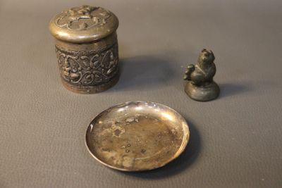 a small silver container and a small silver plate
