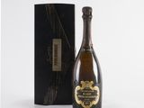 a bottle of champagne in front of a black box