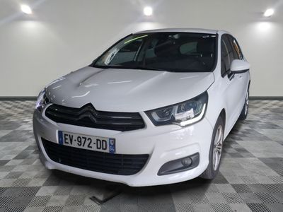 the white car is parked on a checkered floor in the garage