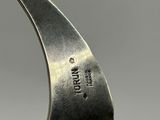 a close up of a spoon with a handle on it