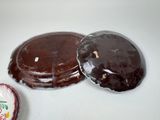 a chocolate cake and a heart shaped box on the table