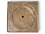 a gold clock with roman numerals on it