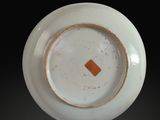 a white plate with a brown square in the center