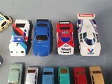 a lot of toy cars that are sitting on a table