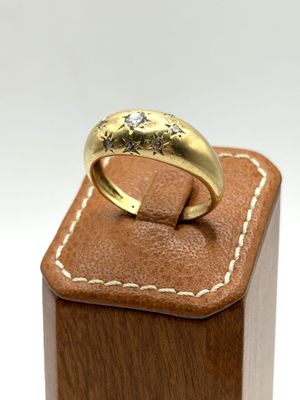 an image of a close up of a ring on top of a wooden box