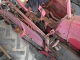 a pink tractor that is parked in a garage