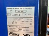 a picture of a blue machine with a sticker on it