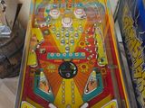a pinball machine that is on display in a room
