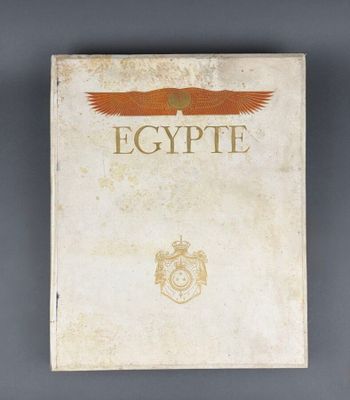 an old book with an eagle on the cover
