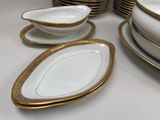 a lot of plates and bowls on the table