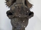 a statue of an elephant that is hanging on the wall