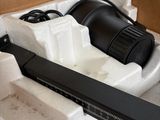 a black blow dryer sitting in a box on a table