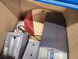 a box with electronic equipment inside of it on the floor