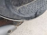 a close up view of a dirty motorcycle tire