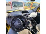dashboard of a small car with a steering wheel and dashboard controls