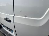 a close up of a car door handle with a sticker on it