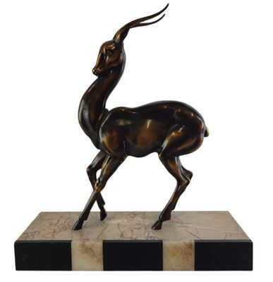 an image of a bronze statue of a deer on a marble base