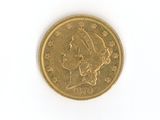 a gold coin with a woman ' s head on it