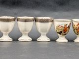seven cups that are lined up in a row