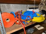 many different colored ropes on a shelf in a room