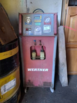 a machine that is sitting in a garage next to a door