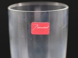 a clear glass with a red sticker on it