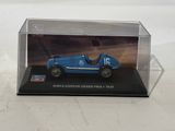 a blue model of a racing car in a clear box