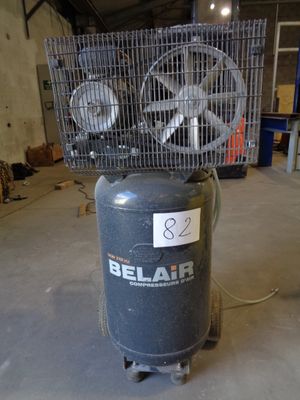 a small air compressor sitting on top of a table