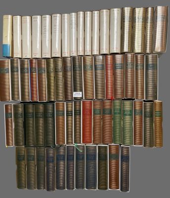 books stacked on top of each other on a shelf