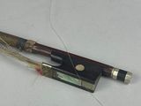 a pen that is laying on a table next to a piece of paper