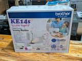 a box that is sitting on a table with a sewing machine