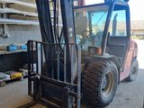 a forklift that is parked in a garage
