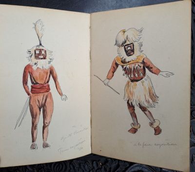 an open book with two drawings of a man and a woman dressed in costumes