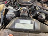 a close up of a car ' s engine with its hood open