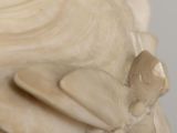 a close up of a sculpture of a bird on a table